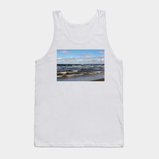 White cumulus clouds in sky over wavy Baltic sea Tank Top